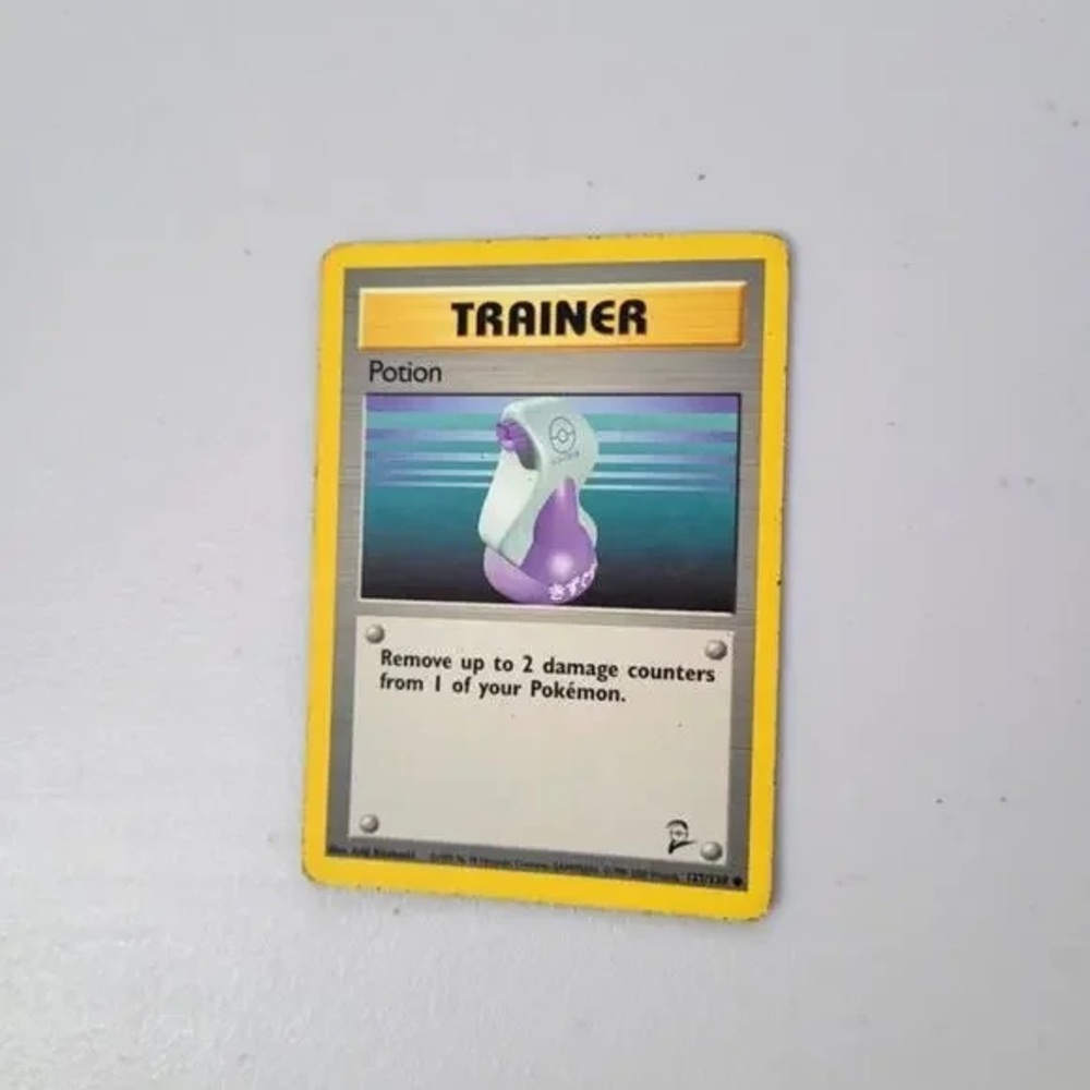 Pokemon Trainer Potion Card with Yellow and Purple
